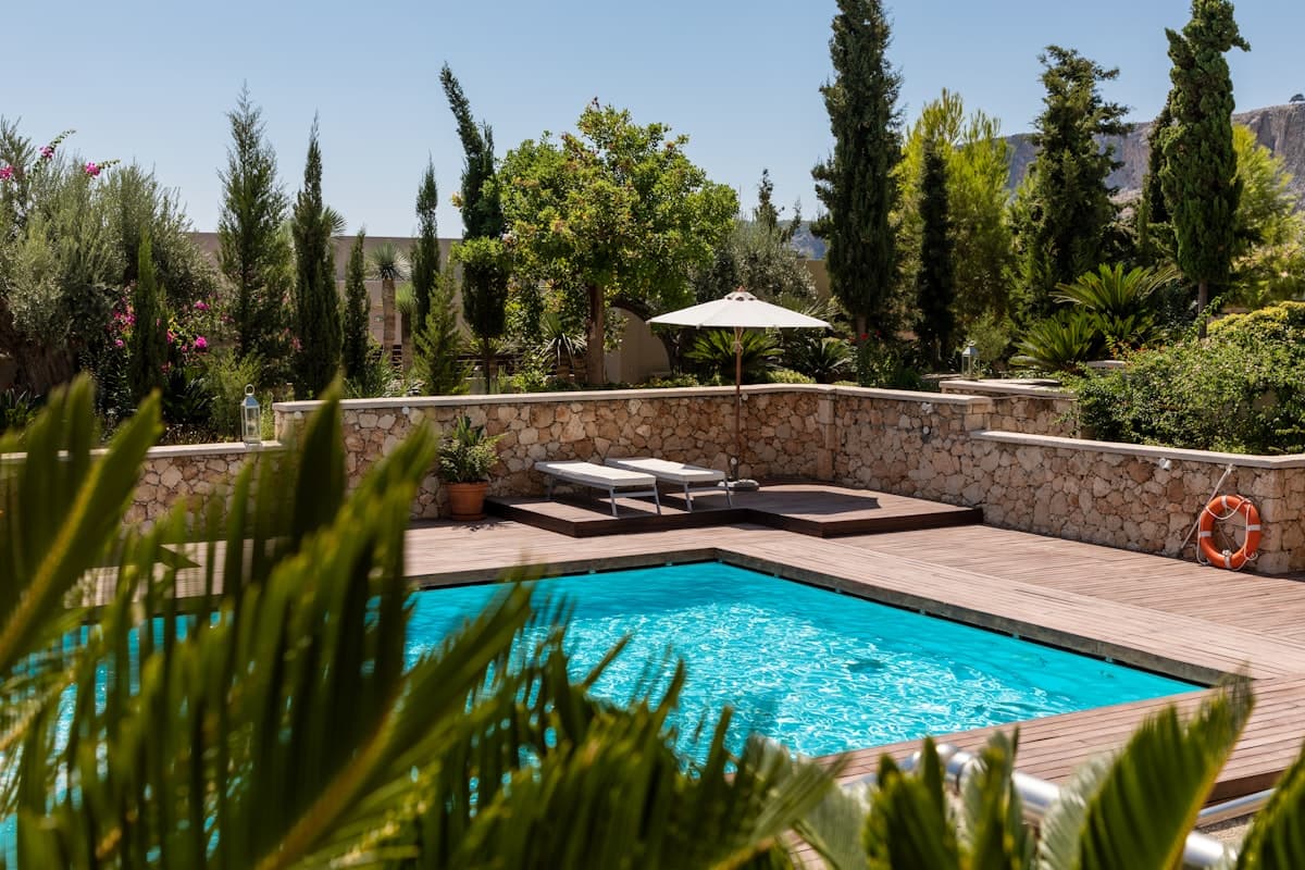 Residential pool and amenity deck on a clear day